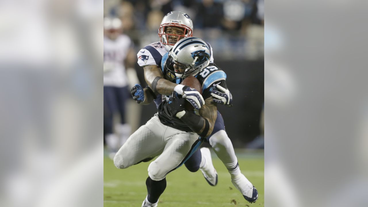 Carolina Panthers' Mike Tolbert, top, is tackled by New England Patriots'  Devin McCourty, bottom, during the second half of an NFL football game in  Charlotte, N.C., Monday, Nov. 18, 2013. (AP Photo/Bob