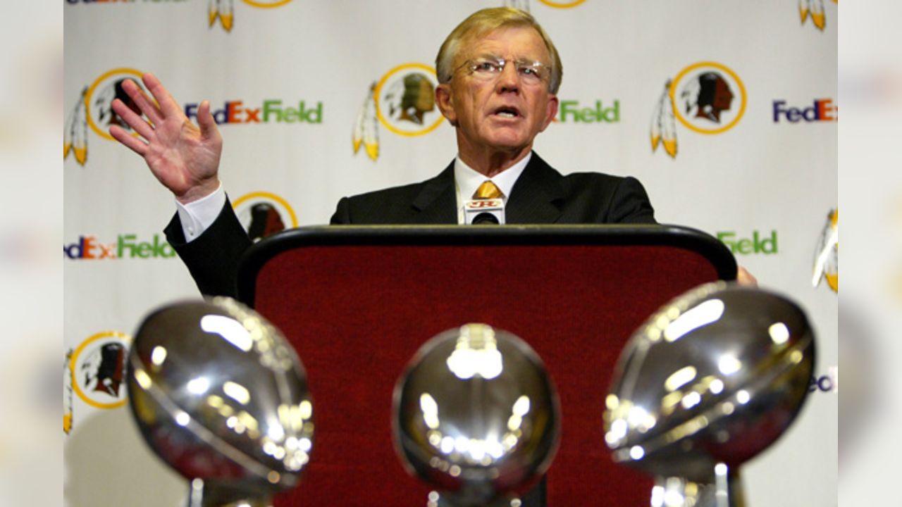 Head coach Joe Gibbs of the Washington Redskins looks on from the