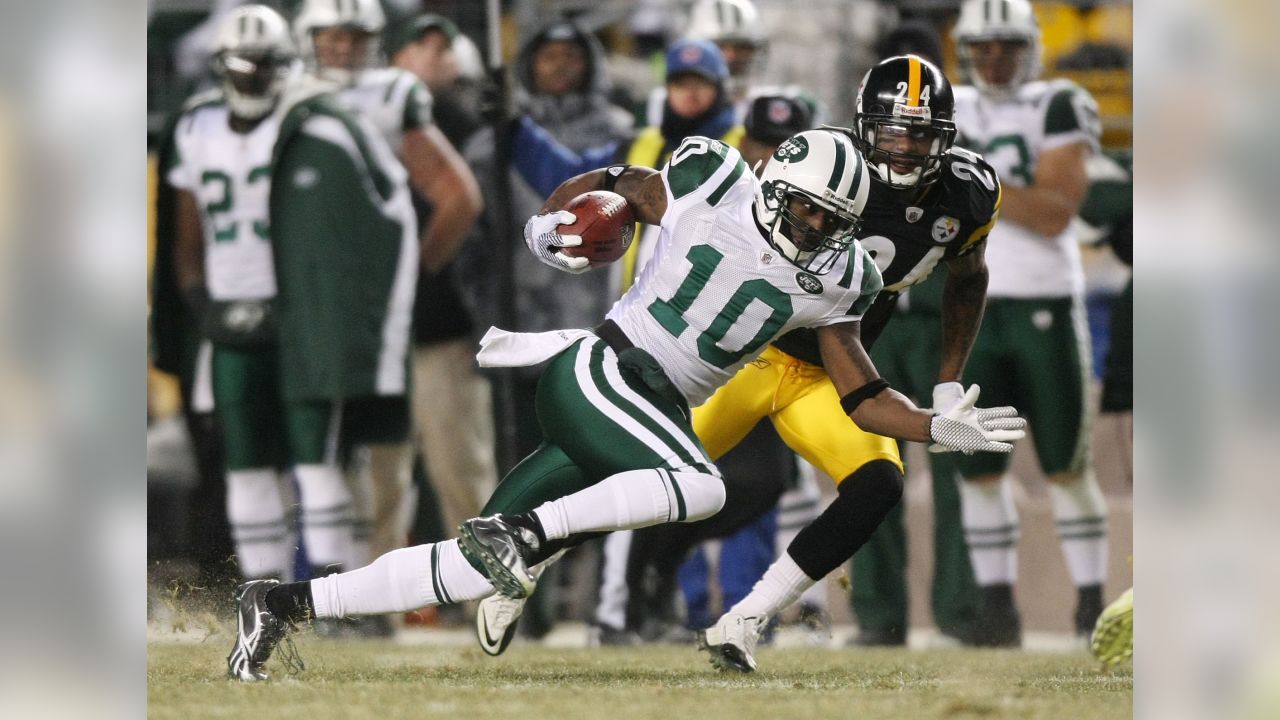 New York Jets' running back Shonn Greene runs over Pittsburgh Steelers'  Ryan Clark as he goes for a first down during the AFC Championship at Heinz  Field in Pittsburgh, Pennsylvania on January