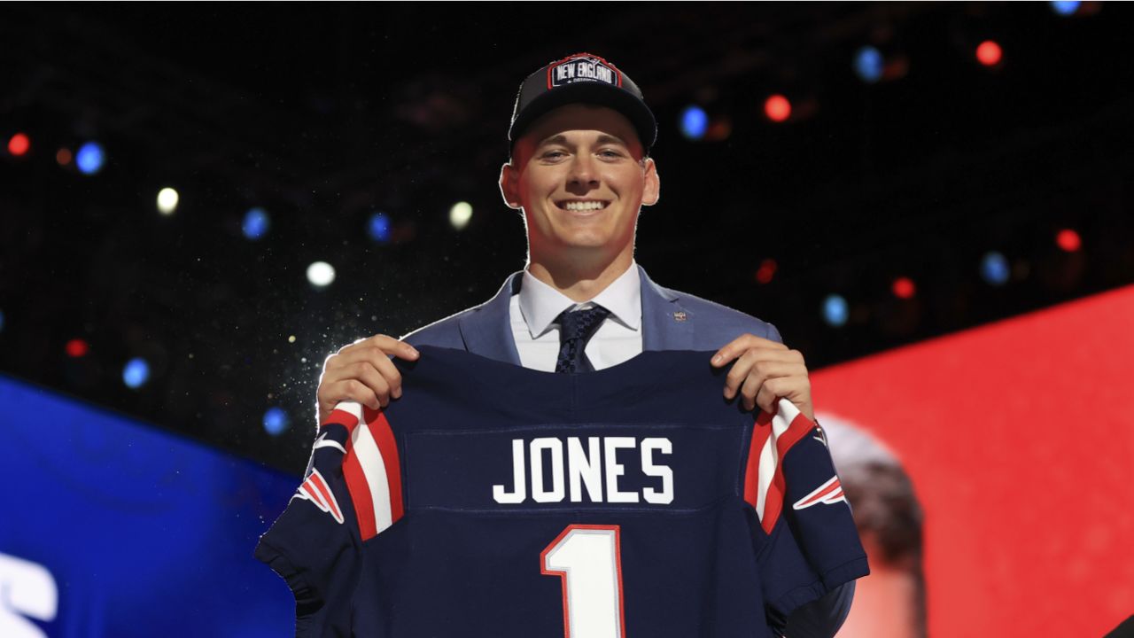 Penn State linebacker Micah Parsons, right, holds a team jersey with NFL  Commissioner Roger Goodell after the was chosen by the Dallas Cowboys with  the 12th pick in the NFL football draft