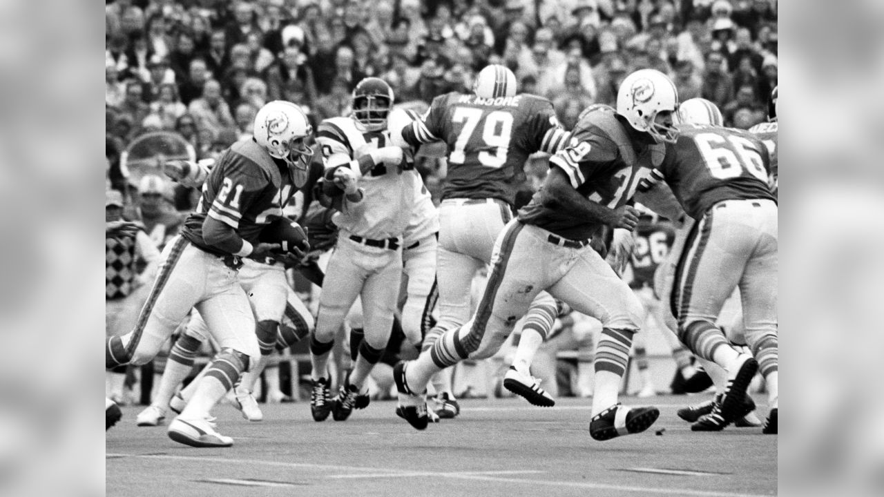 Larry Csonka (39) Miami running back smashes through center for five yards  during second period action against the Minnesota Vikings during Super Bowl  VIIII in Houston, Texas Jan. 13, 1974. Paul Krause (