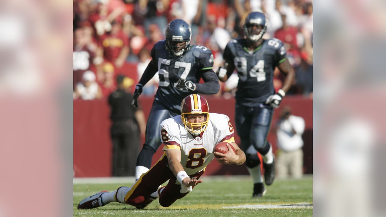 Seattle Seahawks wide receiver Darrell Jackson (82) celebrates in front of  Washington Redskins defensive back Ryan Clark, in back, after scoring a 29  yard touchdown in the second quarter during their NFC