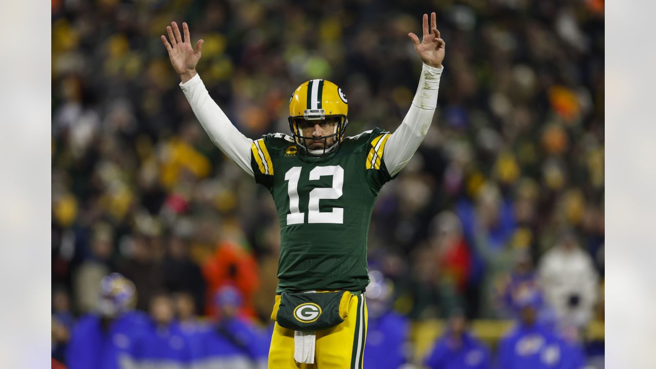 Green Bay Packers quarterback Aaron Rodgers (12) celebrates his