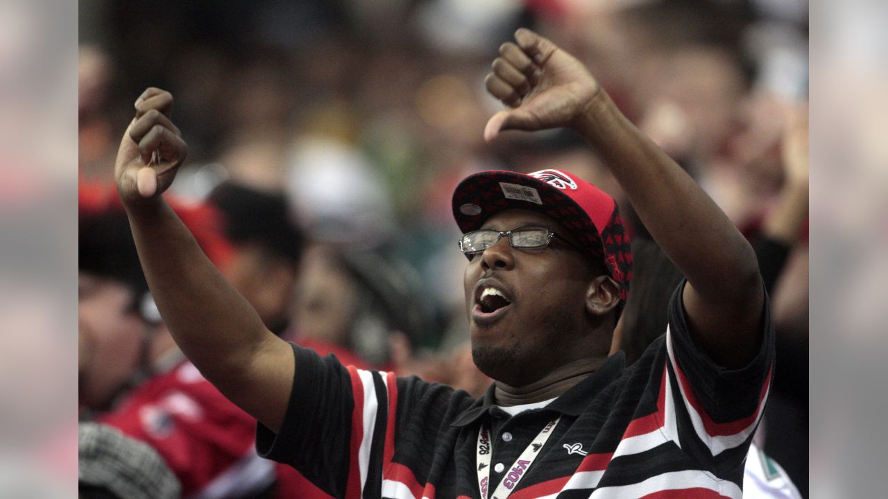 Quarterback Michael Vick of the Atlanta Falcons rolls out against the