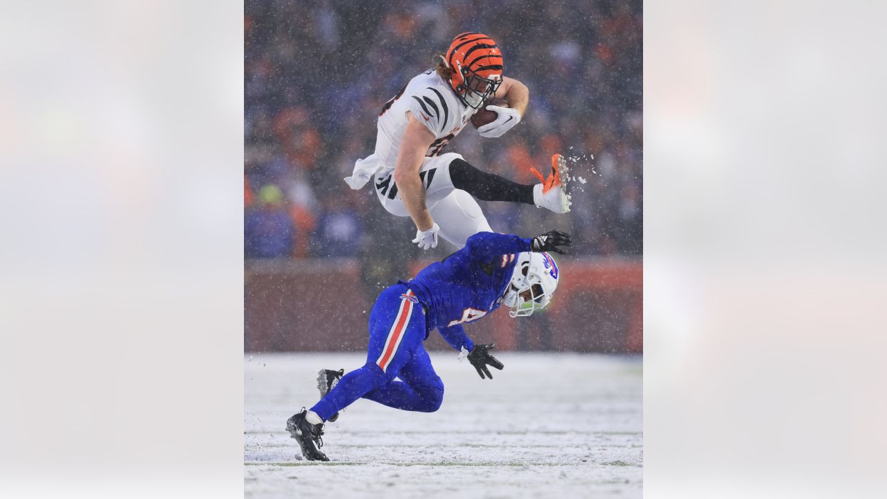 Cincinnati Bengals running back Joe Mixon (28) is tackled by the Buffalo  Bills during the first quarter of an NFL division round football game,  Sunday, Jan. 22, 2023, in Orchard Park, N.Y. (