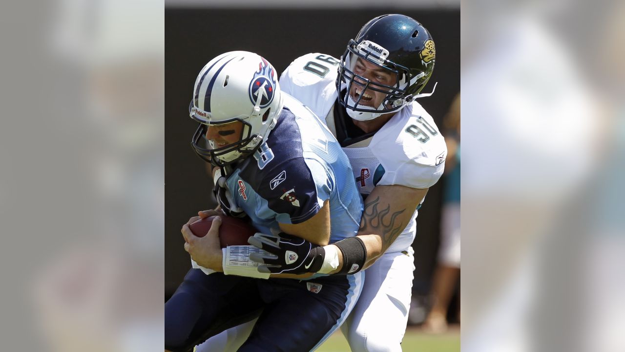 Jacksonville Jaguars' Rashean Mathis (27), left, is tackled by his hair by  Tennessee Titans' Jared Cook (89) on a return play during the second half  of an NFL football game in Jacksonville