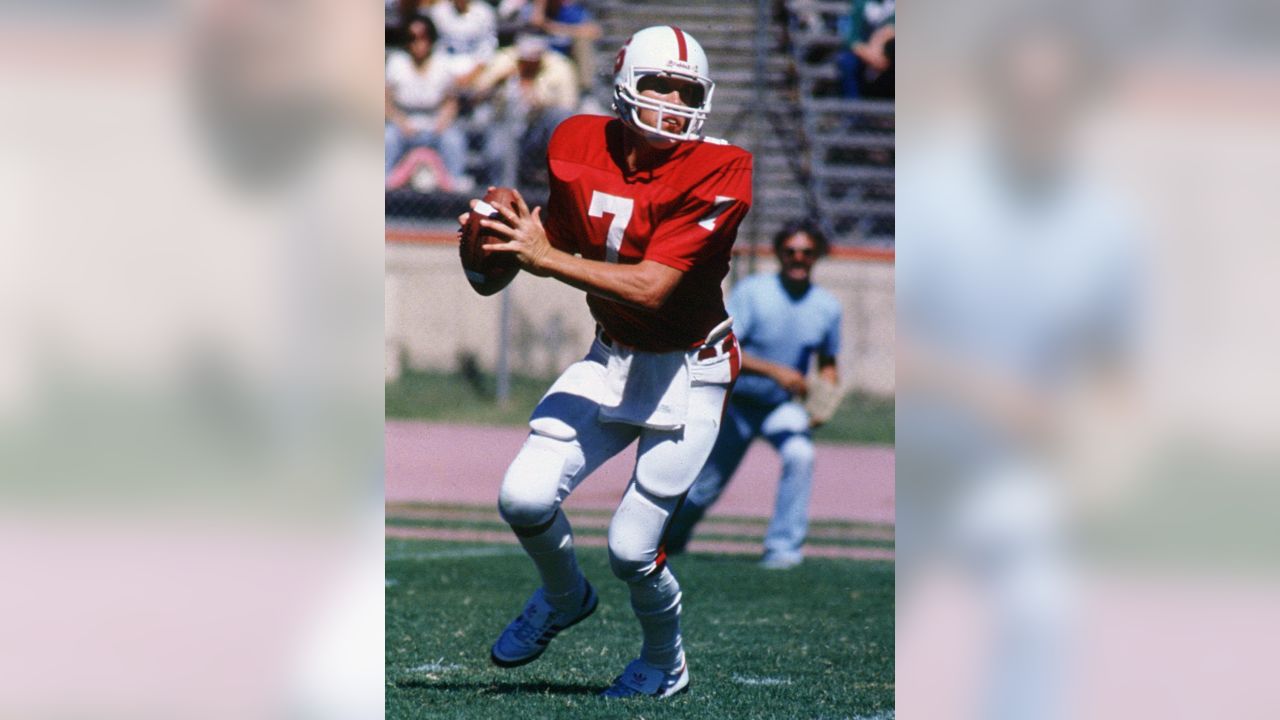 Denver Broncos quarterback John Elway is upended during the third