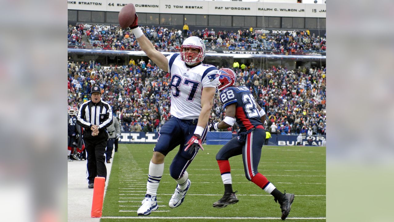 New England Patriots tight end Rob Gronkowski (87) is tripped up by Miami  Dolphins cornerback Will Allen (25) on a 9-yard reception in the fourth  quarter at Gillette Stadium in Foxboro, Massachusetts