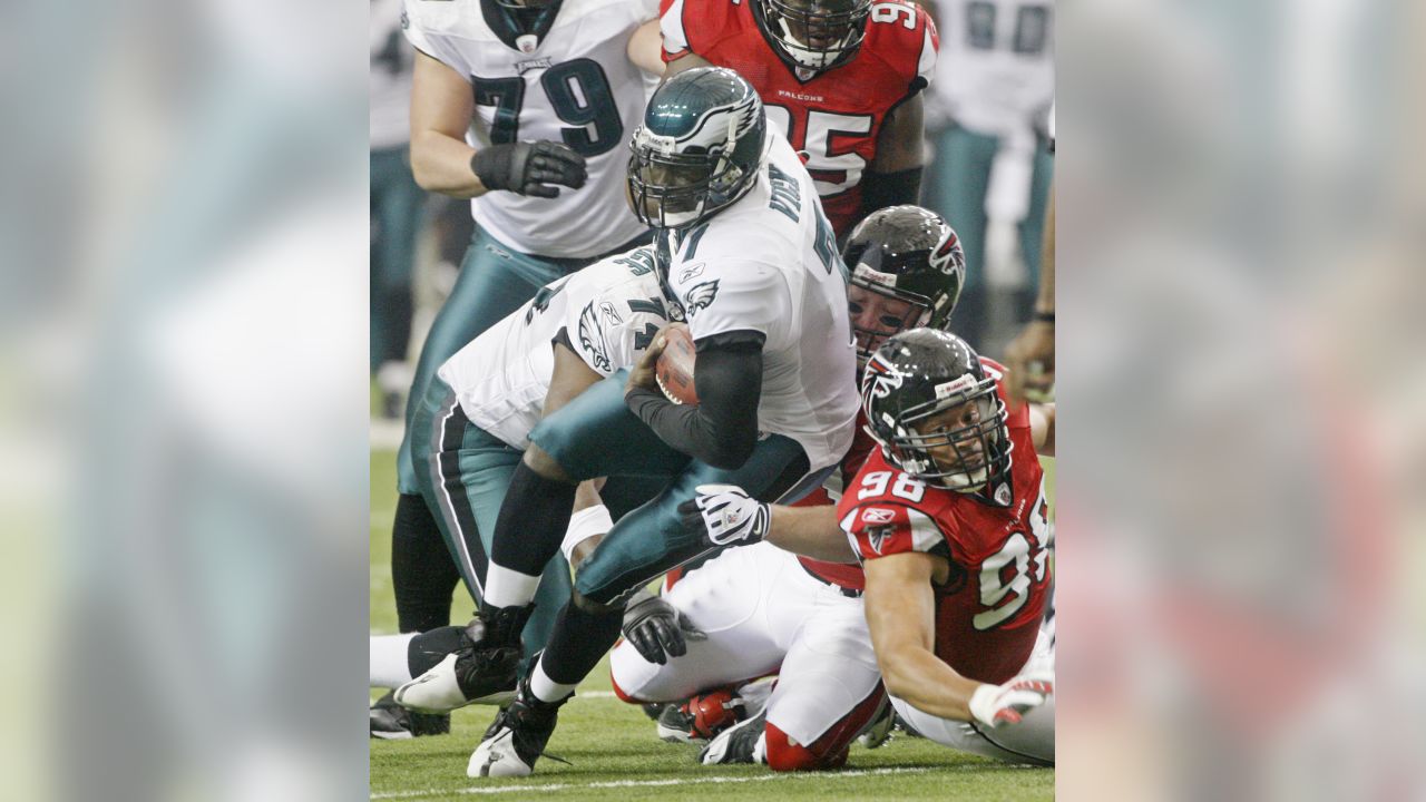 Michael Vick of the Philadelphia Eagles rushes during a game against   Philadelphia eagles cheerleaders, Philadelphia eagles football, Michael vick