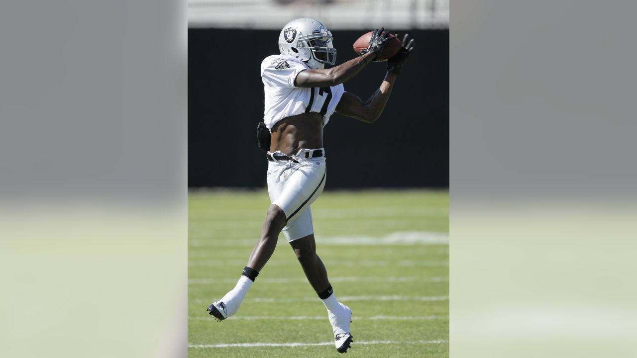 Oakland Raiders running backs Darren McFadden, left, and Rock Cartwright,  right, rest between drills during their NFL football training camp in Napa,  Calif., Thursday, July 28, 2011. (AP Photo/Eric Risberg Stock Photo 