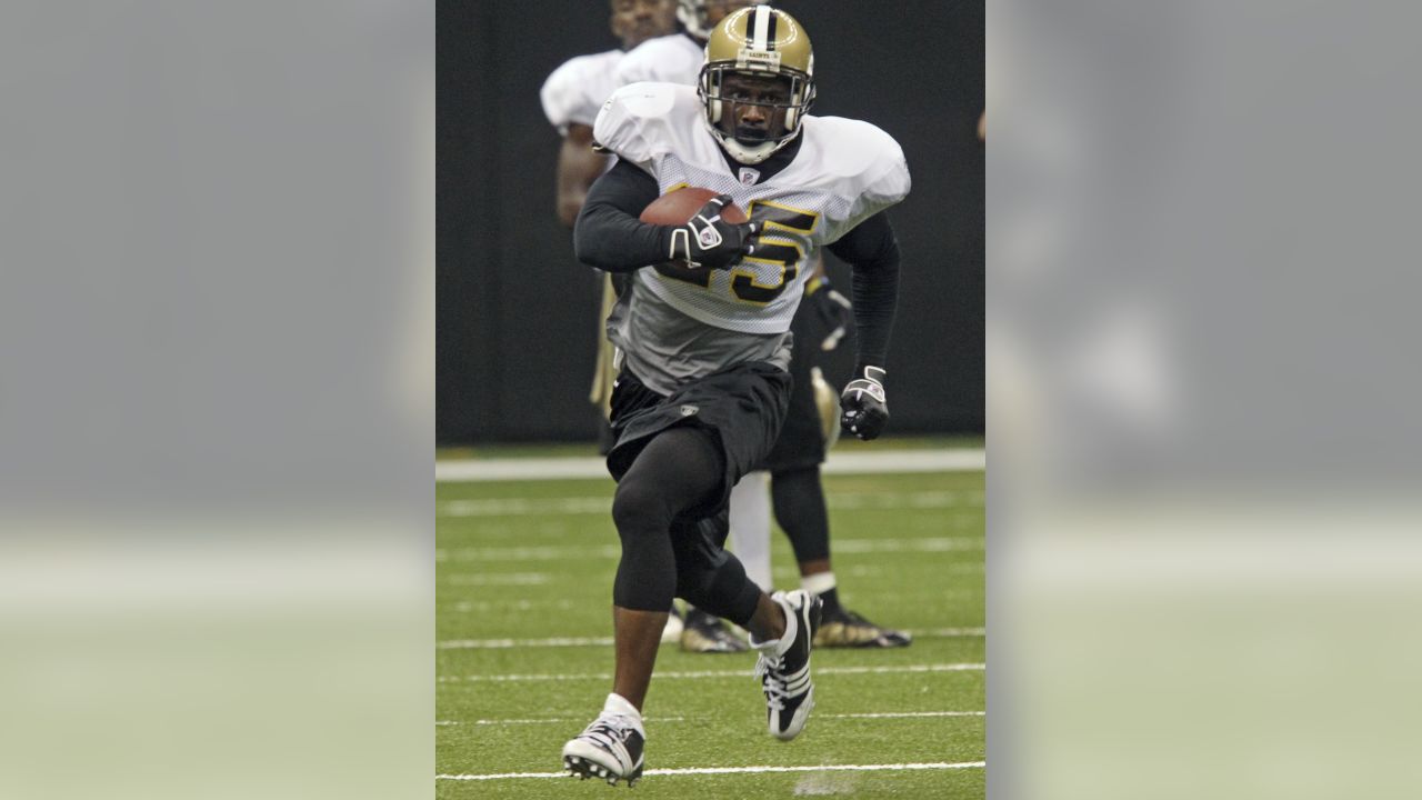 New Orleans Saints linebacker Anthony Waters hols up his jersey