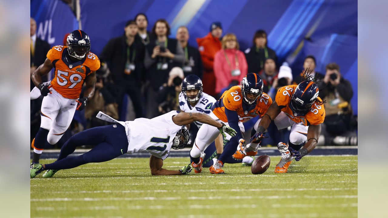 NO FILM, NO VIDEO, NO TV, NO DOCUMENTARY - Denver Broncos running back  Montee Ball (28) is stopped by the Seattle Seahawks in the second quarter  of Super Bowl XLVIII at MetLife