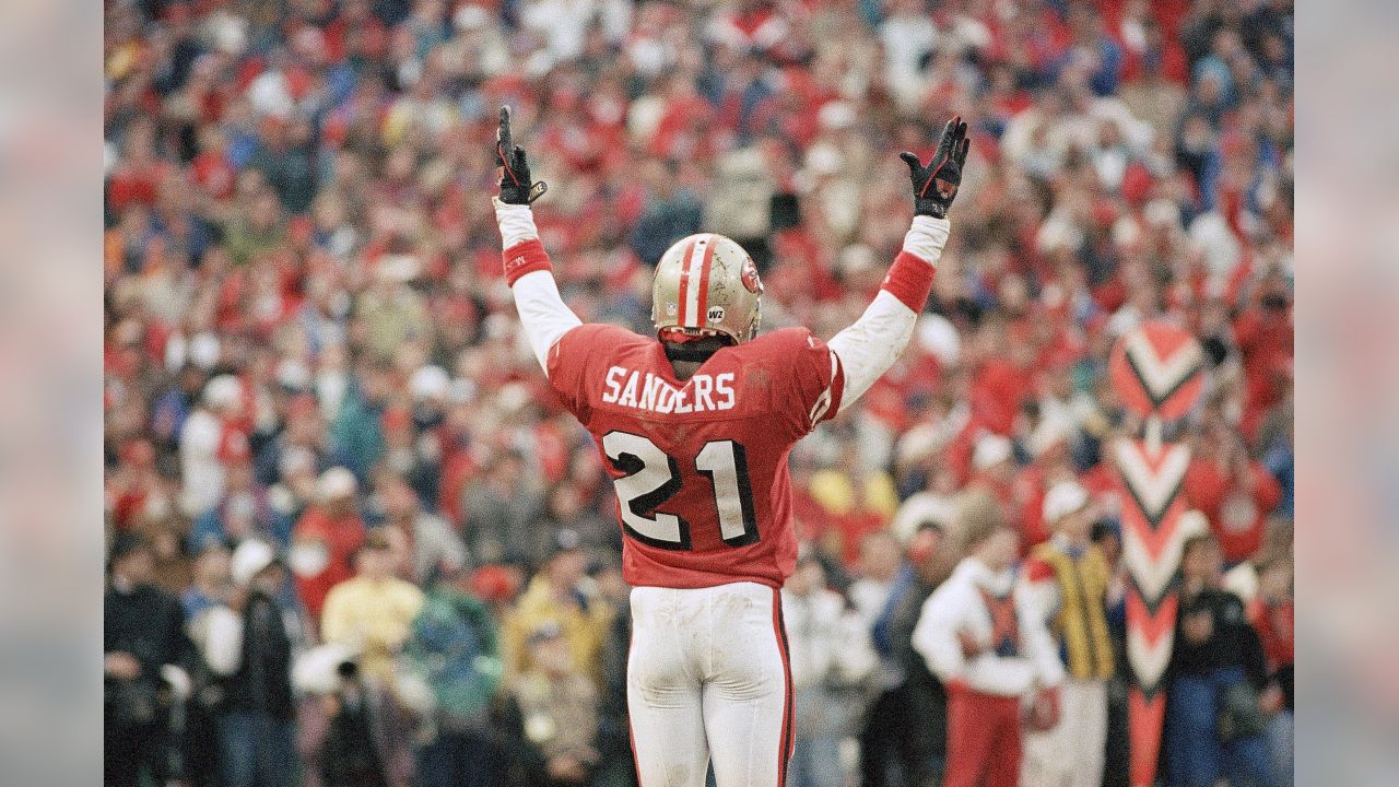 San Francisco 49ers wide receiver Jerry Rice, right, celebrates a first  half touchdown with cornerback Deion Sanders, center, as quarterback Steve  Young (8) looks on at the Georgia Dome in Atlanta on