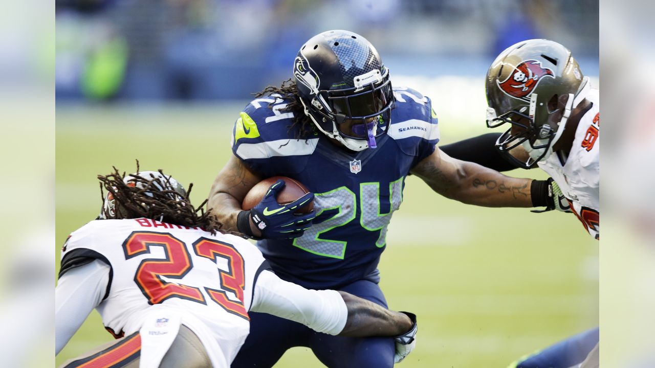 Buffalo Bills' Marshawn Lynch (23) is tackled by Houston Texans' DeMeco  Ryans (59) during the first