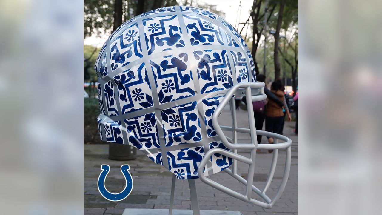 Artists take on all 32 NFL team helmets
