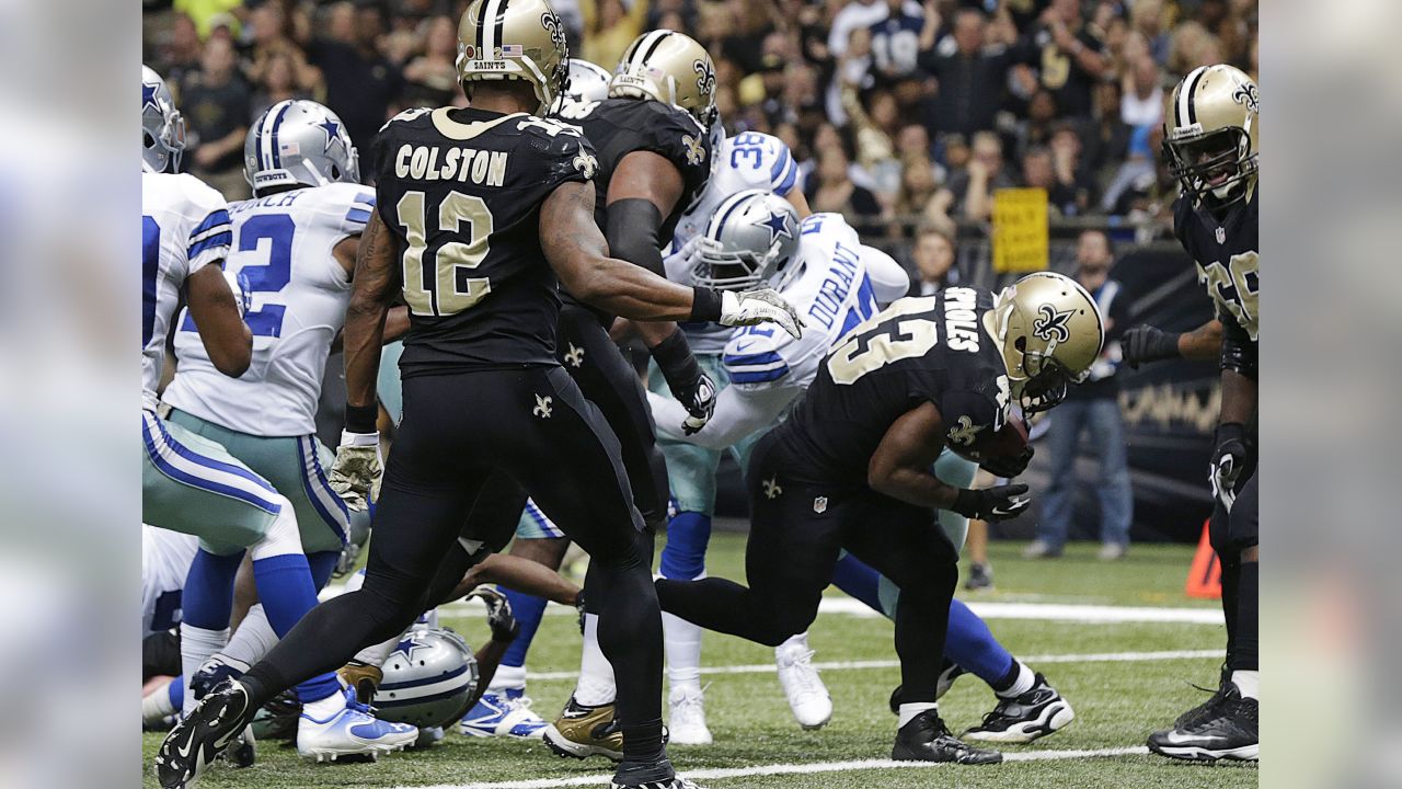 Dallas Cowboys running back DeMarco Murray (29) scores a touchdown in front  of New Orleans Saints outside linebacker Will Herring in the first half of  an NFL football game in New Orleans