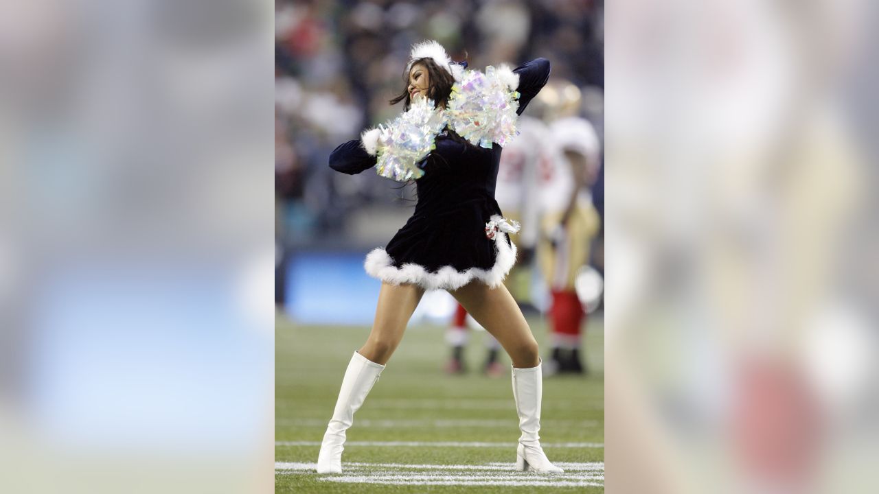 A Washington Commanders cheerleader performs during the first half of an  NFL preseason football game between the Washington Commanders and the  Baltimore Ravens, Monday, Aug. 21, 2023, in Landover, Md. The Commanders