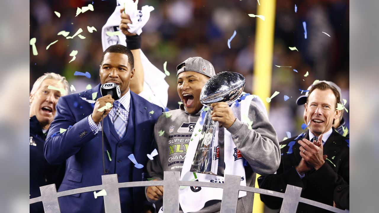 A group of Seattle Seahawks fans celebrate the win following the Super Bowl  XLVIII at MetLife Stadium in East Rutherford, New Jersey on February 2,  2014. The Seattle Seahawks whipped the Denver