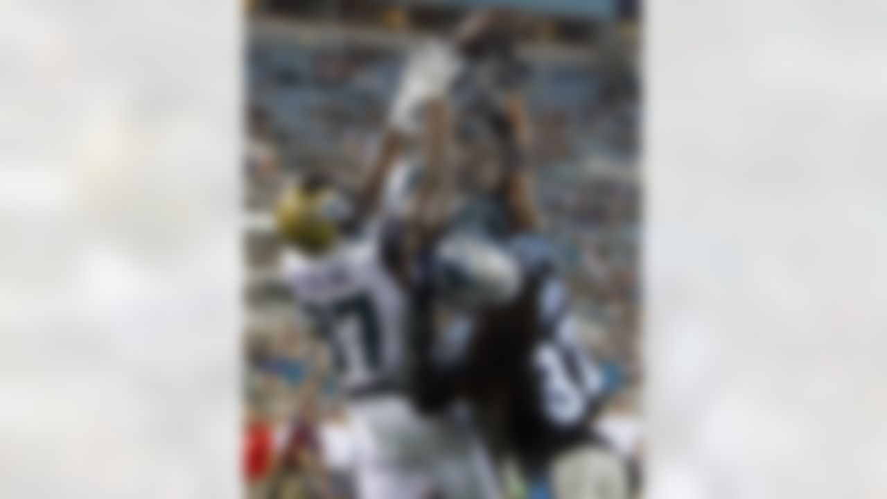 Carolina Panthers cornerback Jeff Richards, center, intercepts a 2-point conversion pass intended for Jacksonville Jaguars tight end Neal Sterling (87) as safety Dezmen Southward (37) comes in to help during the second half of an NFL preseason football game, Thursday, Aug. 24, 2017, in Jacksonville, Fla. (AP Photo/Stephen B. Morton)