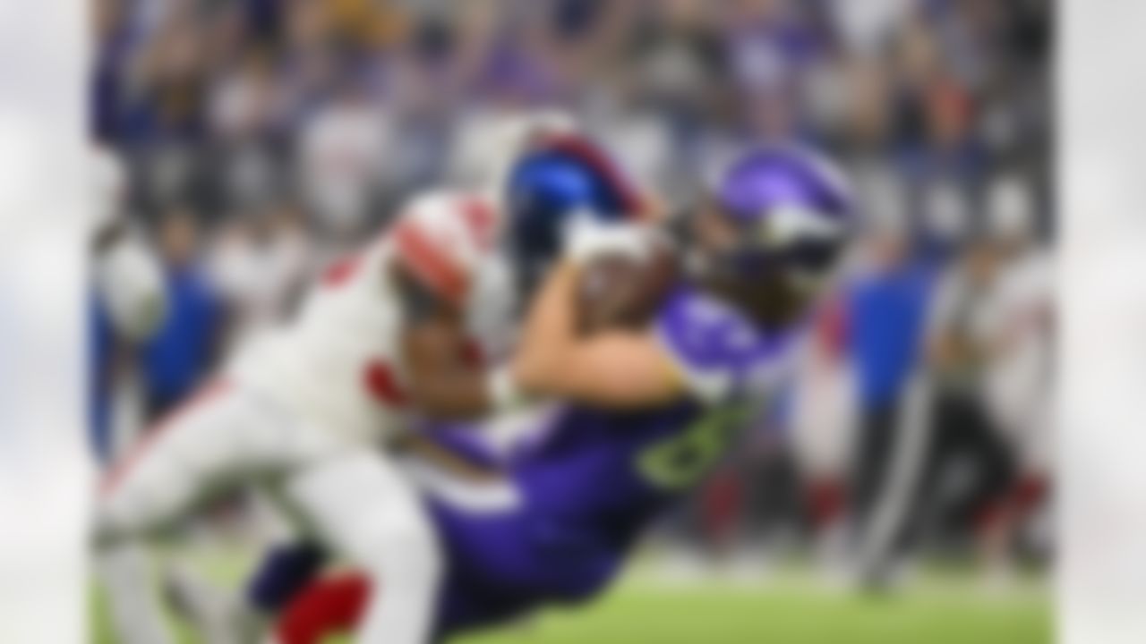 Minnesota Vikings tight end T.J. Hockenson (87) is tackled by New York Giants cornerback Darnay Holmes (30) during an NFL Super Wild Card Weekend playoff game on Sunday, January 15, 2023 in Minneapolis, Minnesota.