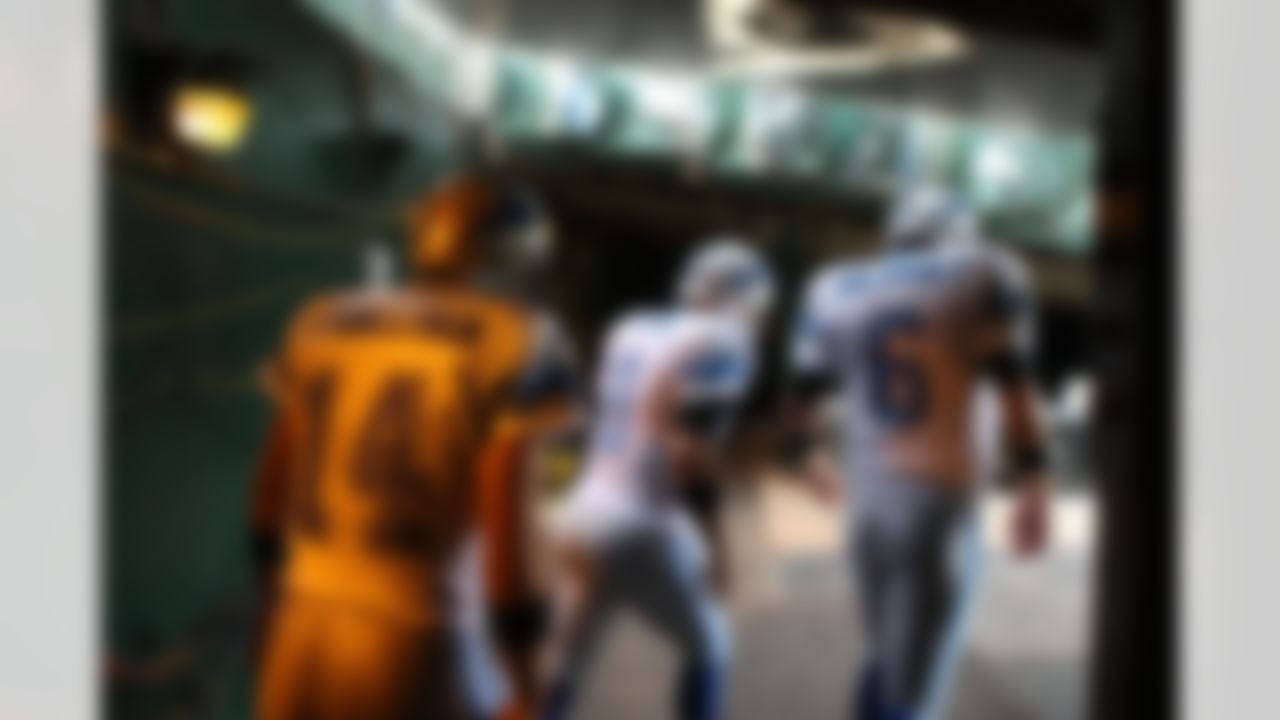 OAKLAND, CA - SEPTEMBER 09:  Quaterbacks J.T. O'Sullivan #14, Jon Kitna #8 and Dan Orlovsky #6 of the Detroit Lions enter the field prior to their game against the Oakland Raiders on September 9, 2007 at McAfee Coliseum in Oakland, California.  (Photo by Jed Jacobsohn/Getty Images)