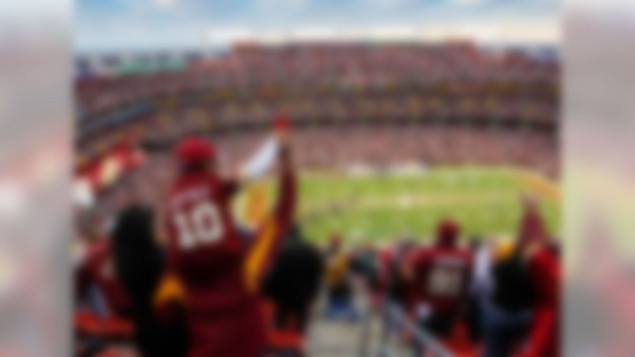 Fans cheer on the Washington Redskins from the top row of FedExField before a wild-card showdown against the Seattle Seahawks.  (Daniel Shirey/US Presswire)