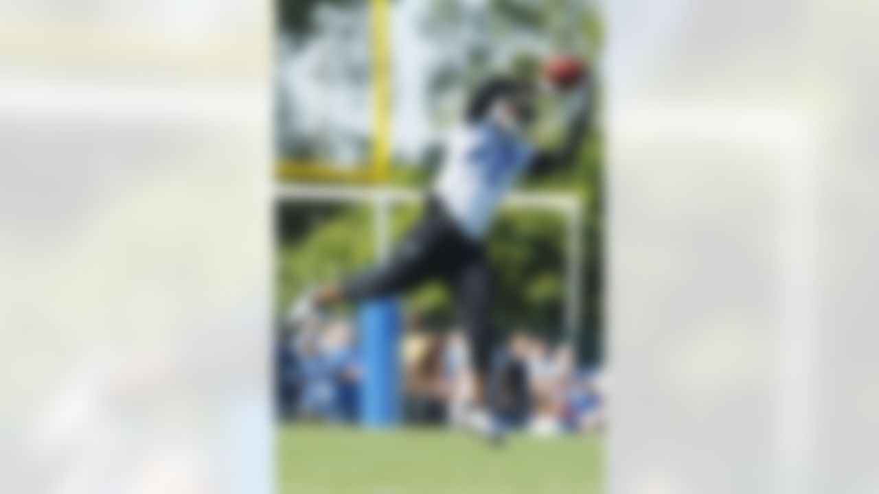 Detroit Lions cornerback Amari Spievey (42) makes a catch during NFL football training camp at the team's practice facility in Allen Park, Mich., Saturday, July 30, 2011. (AP Photo/Rick Osentoski)