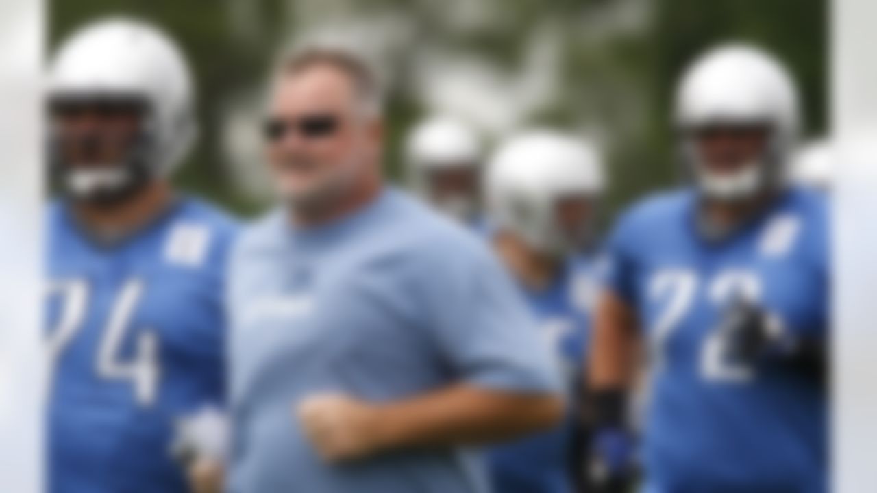 Detroit Lions offensive line coach George Yarno runs with the team during NFL football minicamp at the teams' training facility in Allen Park, Mich., Thursday, June 24, 2010. (AP Photo/Carlos Osorio)
