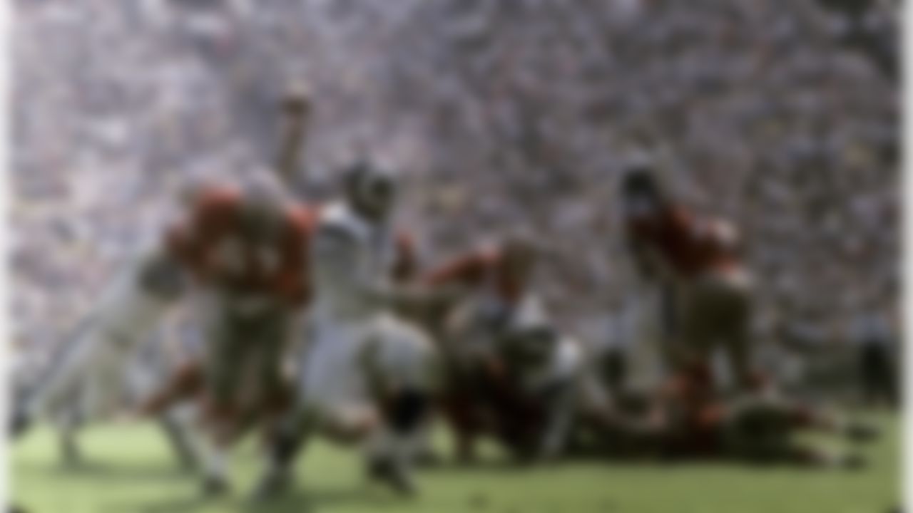 The "Fearsome Foursome" of the Los Angeles Rams--defensive ends Lamar Lundy (85) and Hall-of-Famer Deacon Jones (75) and defensive tackles Rosey Grier (76) and Hall-of-Famer Merlin Olsen (74)--show where they got their name with their ferocious pass rush. (National Football League)