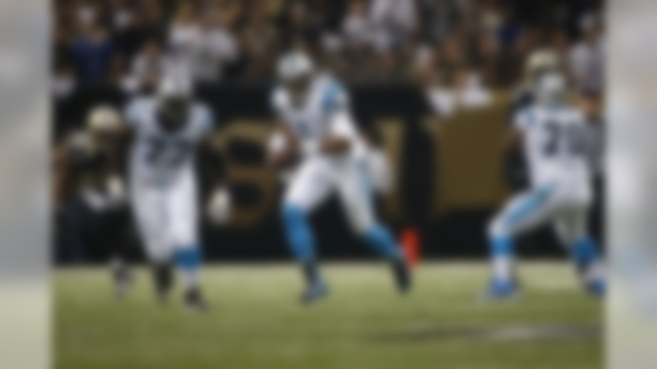 Carolina Panthers quarterback Cam Newton (1) runs with the football during a game against the New Orleans Saints at the Mercedes-Benz Superdome on Sunday, Dec. 8, 2013, in New Orleans, Louisiana. (Perry Knotts/NFL)