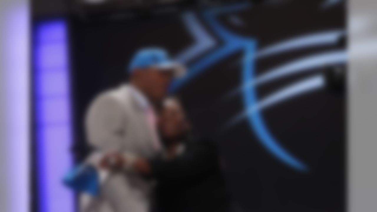 Auburn Quarterback Cam Newton  hugs a loved one after he was selected as the first pick overall by the Carolina Panthers in the first round of the NFL football draft at Radio City Music Hall Thursday, April 28, 2011, in New York. (AP Photo/Jason DeCrow)