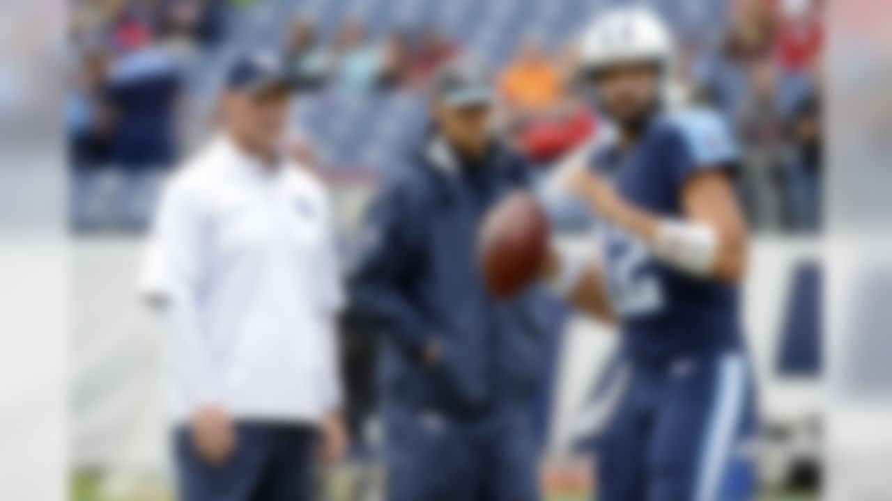 Injured Tennessee Titans quarterback Marcus Mariota, center, watches with head coach Ken Whisenhunt, left, as quarterback Charlie Whitehurst (12) warms up  before an NFL football game between the Titans and the Atlanta Falcons Sunday, Oct. 25, 2015, in Nashville, Tenn. (AP Photo/Mark Zaleski)