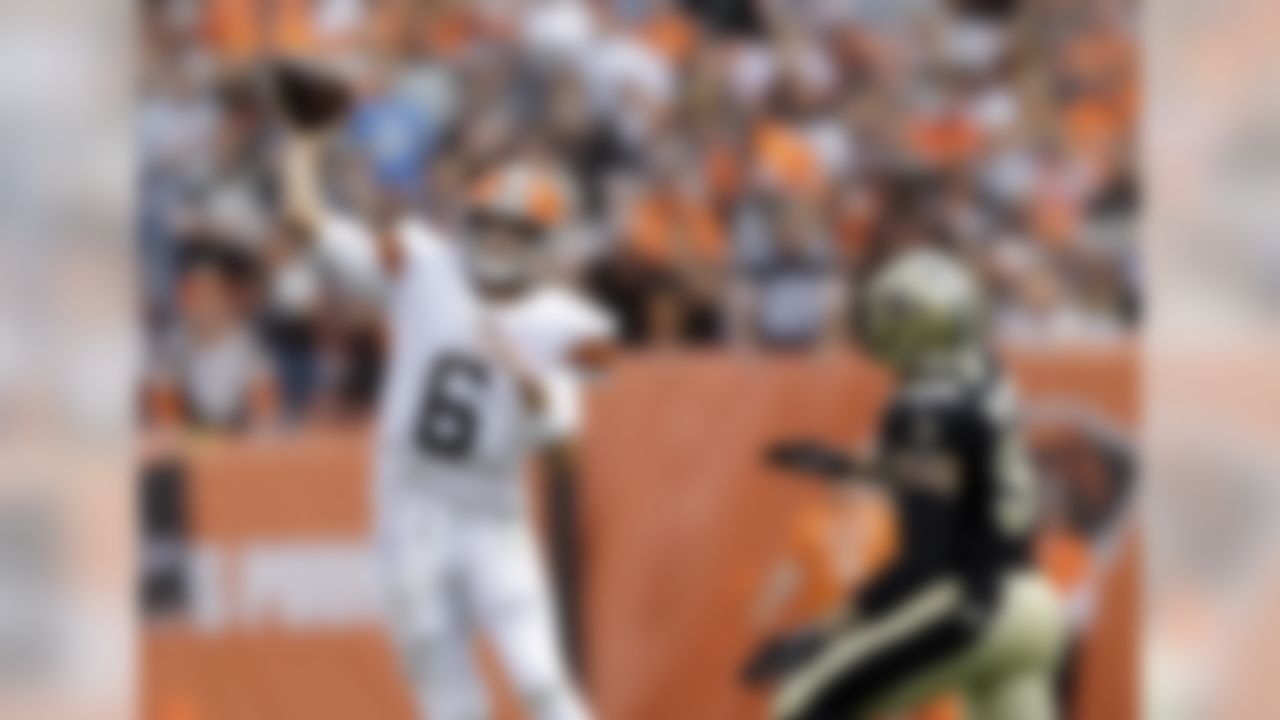 Cleveland Browns quarterback Brian Hoyer (6) throws under pressure from New Orleans Saints strong safety Kenny Vaccaro in the first quarter of an NFL football game Sunday, Sept. 14, 2014, in Cleveland. (AP Photo/Tony Dejak)