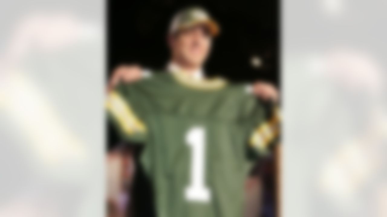 Aaron Rodgers, a quarterback from California, holds up a Green Bay Packers jersey after being picked 24th overall in the NFL Draft Saturday, April 23, 2005 in New York.