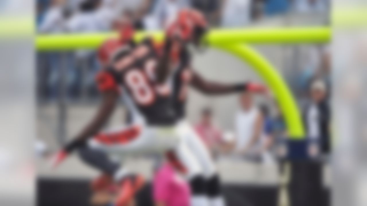 Cincinnati Bengals wide receiver A.J. Green, left, celebrates his 37-yard touchdown reception against the Jacksonville Jaguars with teammate wide receiver Jerome Simpson (89) during the first half of an NFL football game on Sunday, Oct. 9, 2011, in Jacksonville, Fla. (AP Photo/Stephen Morton)