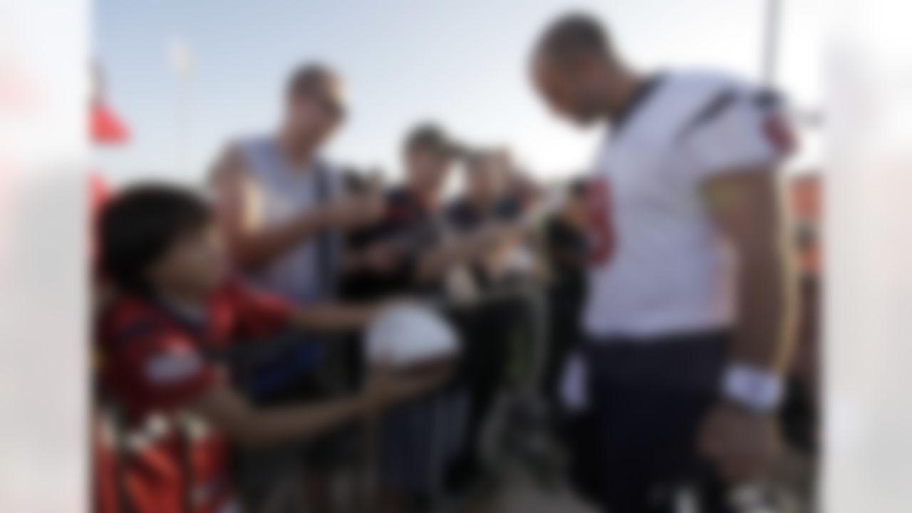 Houston Texans quarterback Matt Schaub (8) signs autographs for fans before the start of a NFL training camp, Friday, July 30, 2010 in Houston. The Texans held their first training camp practice of this season Friday. (AP Photo/David J. Phillip)