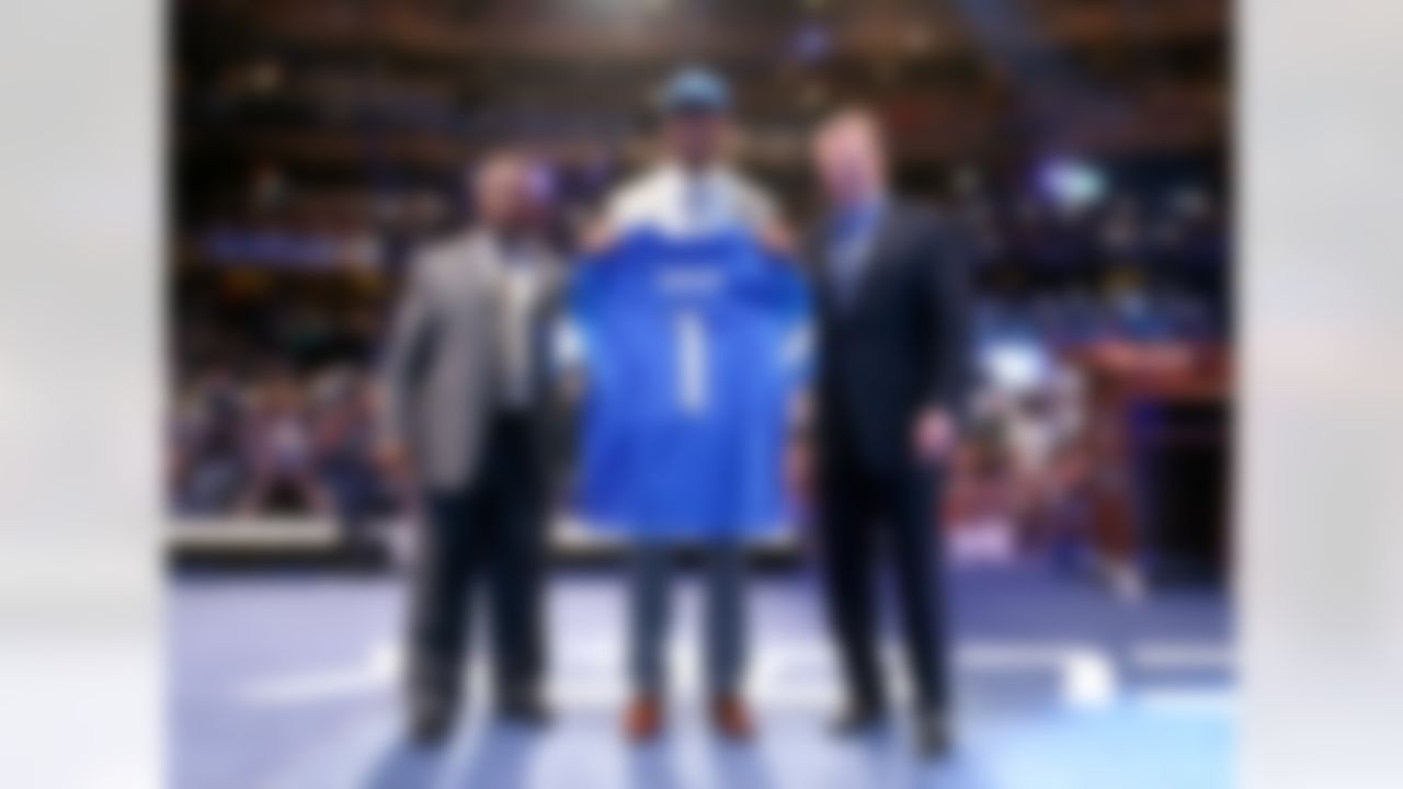 Eric Ebron poses for a picture with Hall of Fame running back Barry Sanders and NFL Commissioner Roger Goodell after bering selected by the Detroit Lions during the 2014 NFL Draft at Radio City Music Hall on May 8, 2014 in New York, NY. (Ben Liebenberg/NFL)