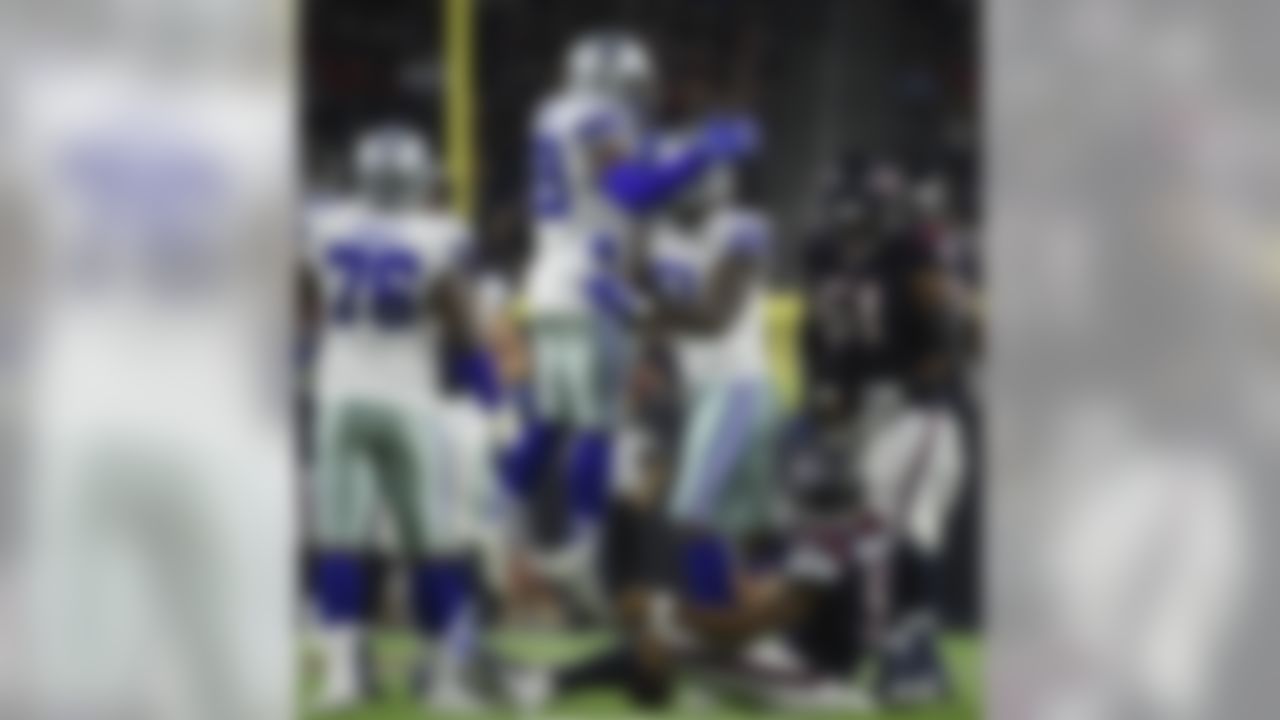 Dallas Cowboys defensive tackle Jihad Ward (51) celebrates with teammate Charles Tapper (99) after sacking Houston Texans quarterback Joe Webb (5) during the first half of a preseason NFL football game Thursday, Aug. 30, 2018, in Houston. (AP Photo/Eric Christian Smith)