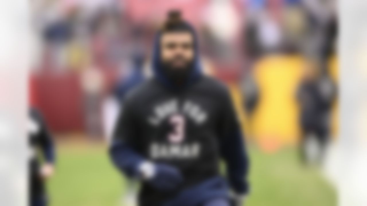 Dallas Cowboys running back Ezekiel Elliott (21) wearing a t-shirt with message for Buffalo Bills safety Damar Hamlin before the start of an NFL football game against the Washington Commanders, Sunday, Jan. 8, 2023, in Landover, Md.