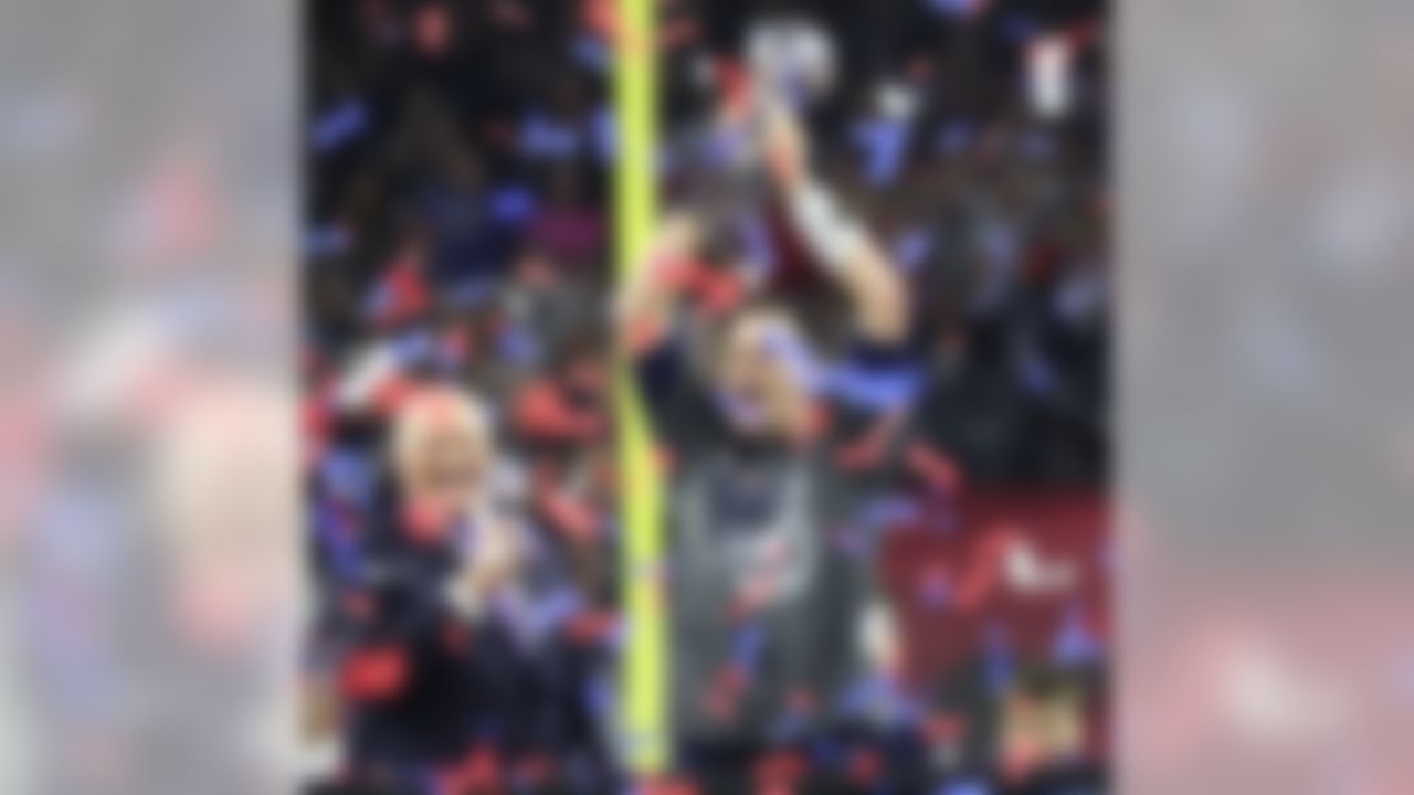 New England Patriots quarterback Tom Brady (12) hoists the Lombardi Trophy after defeating the Atlanta Falcons in  the NFL Super Bowl LI football game on Sunday, Feb. 5, 2017 in Houston. (Todd Rosenberg/NFL)