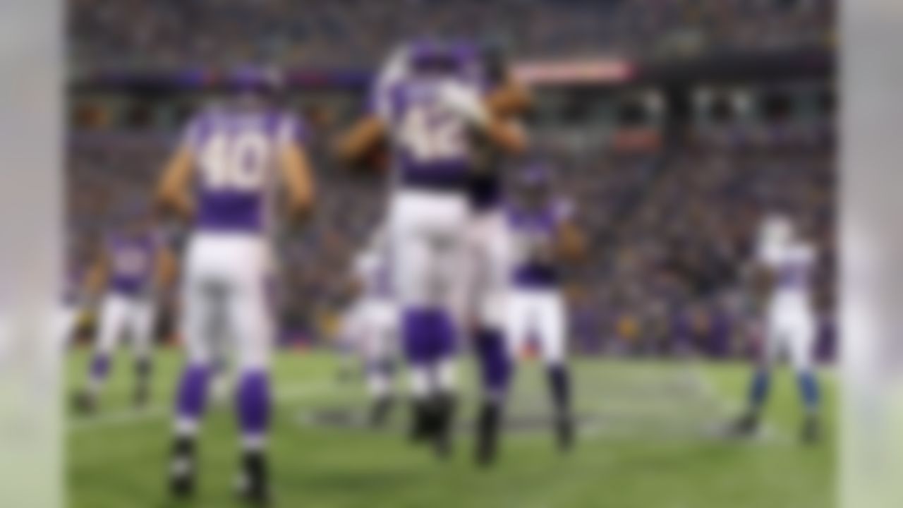 Minnesota Vikings running back Jerome Felton (42) celebrates his touchdown against the Buffalo Bills in the first half of an NFL preseason football game, Friday, Aug. 17, 2012, in Minneapolis. (AP Photo/Genevieve Ross)