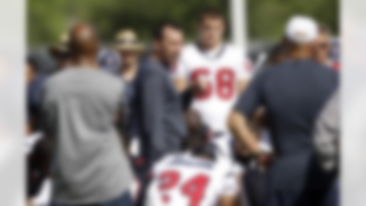 Houston Texans coach Gary Kubiak, center, talks to his team during NFL football training camp, Saturday, July 31, 2010 in Houston. (AP Photo/David J. Phillip)