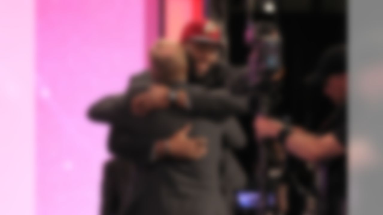 Morgan Moses hugs NFL Commissioner Roger Goodell during the 2014 NFL Draft at Radio City Music Hall on May 9, 2014 in New York, NY. (Perry Knotts/NFL)