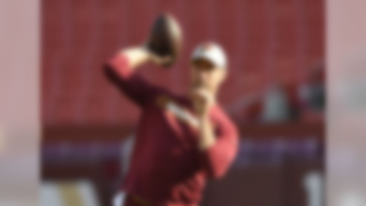 Washington Redskins quarterback Alex Smith warms up before an NFL football game against the Denver Broncos, Friday, Aug. 24, 2018, in Landover, Md. (AP Photo/Nick Wass)