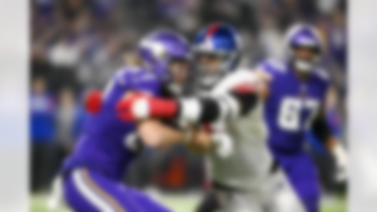 Minnesota Vikings tight end T.J. Hockenson (87) is tackled by New York Giants defensive end Kayvon Thibodeaux (5) during an NFL Super Wild Card Weekend playoff game on Sunday, January 15, 2023 in Minneapolis, Minnesota.