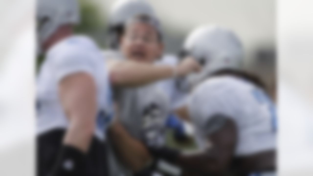Detroit Lions defensive line coach Kris Kocurek instructs his players during practice at NFL football training camp in Allen Park, Mich., Tuesday, Aug. 2, 2011. (AP Photo/Carlos Osorio)