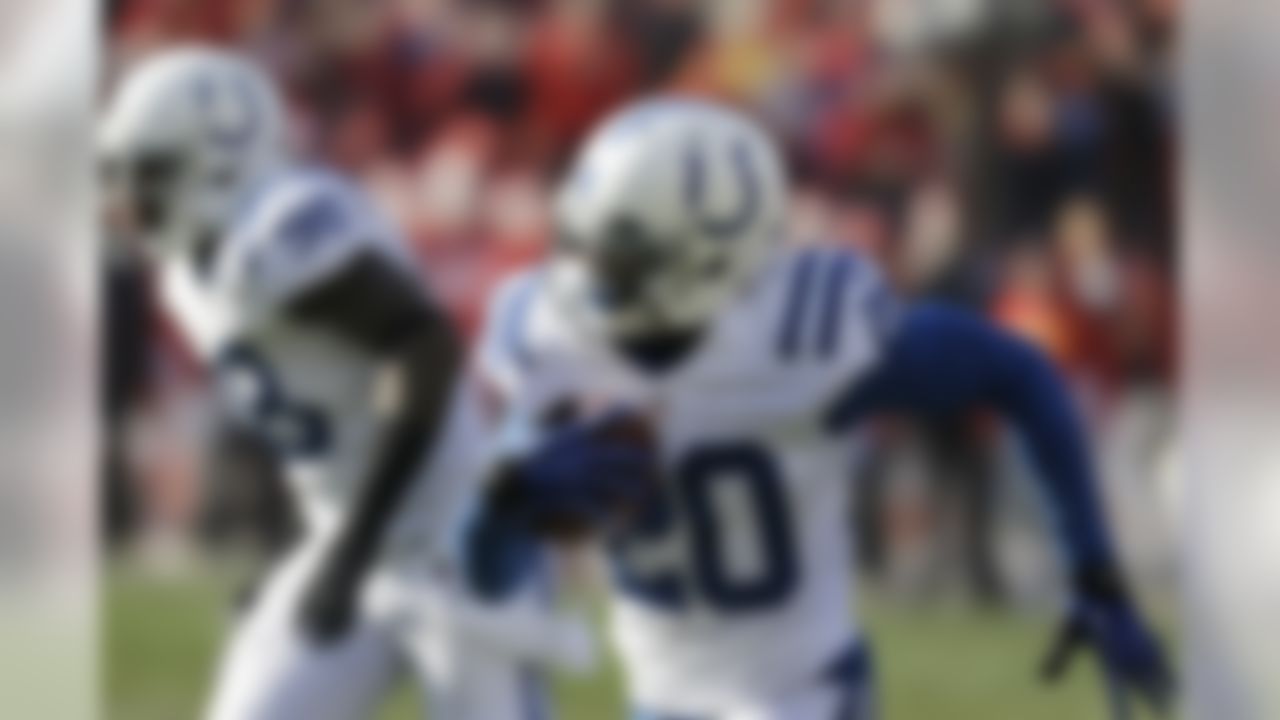 Indianapolis Colts cornerback Darius Butler, right, returns an interception 32 yards for a touchdown during the first half of an NFL football game against the Kansas City Chiefs, Sunday, Dec. 23, 2012, in Kansas City, Mo. (AP Photo/Orlin Wagner)