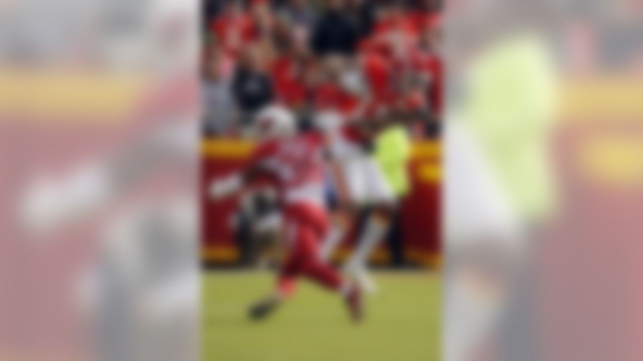 Kansas City Chiefs wide receiver Demarcus Robinson (11) makes a catch against Arizona Cardinals safety Budda Baker (36) during the first half of an NFL football game in Kansas City, Mo., Sunday, Nov. 11, 2018. (AP Photo/Charlie Riedel)