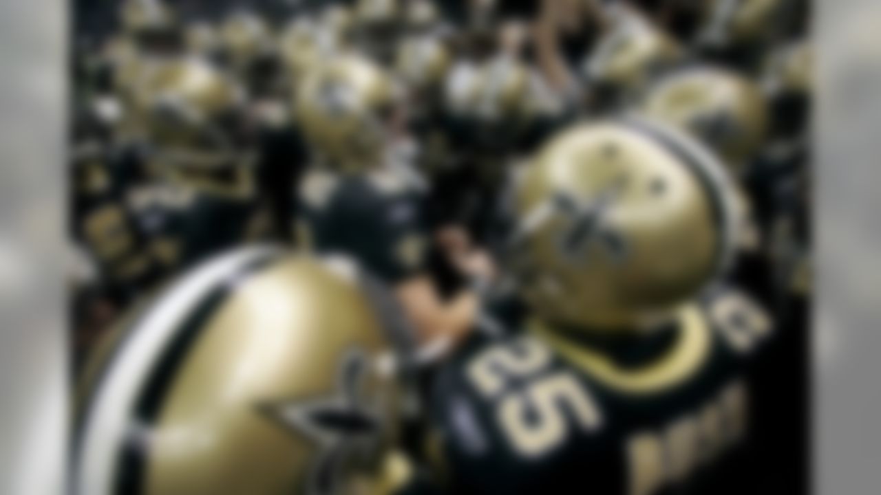 New Orleans Saints quarterback Drew Brees (9) leads his team in a pregame cheer before their NFL football game against the Carolina Panthers in New Orleans, Sunday, Nov. 8, 2009. (AP Photo/Dave Martin)