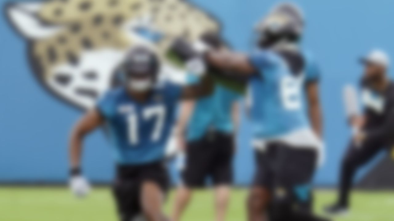 Jacksonville Jaguars wide receiver DJ Chark Jr. (17) runs through a drill with wide receiver Josh Hammond, right, during an NFL football practice, Monday, June 14, 2021, in Jacksonville, Fla.